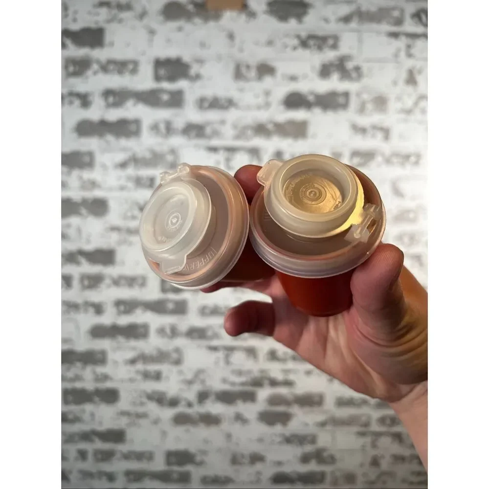 Tupperware | vintage spice salt and pepper shakers orange and red